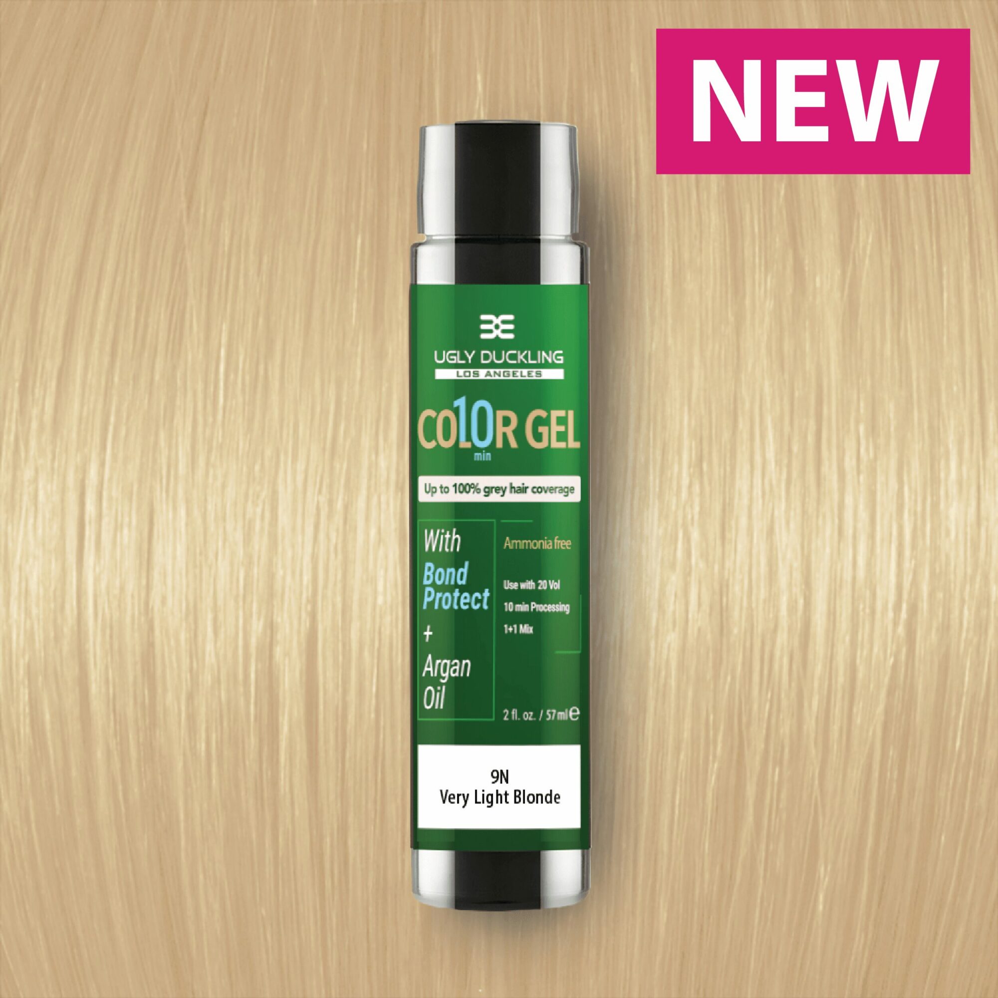 Green and white bottle of color gel hair product on wooden surface with pink 'NEW' label in corner