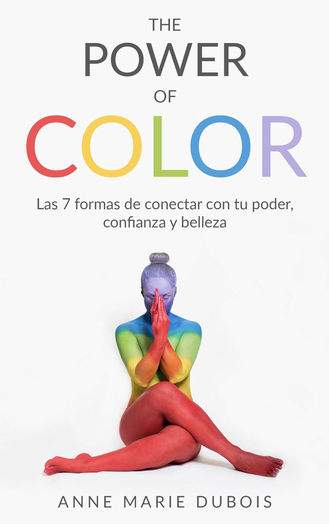 Person sitting cross-legged with hands in prayer, body painted in rainbow colors, on a white background.