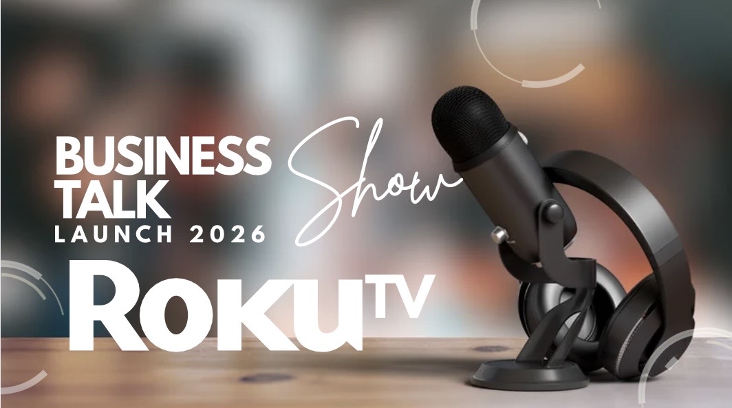 Microphone and headphones on a desk with blurred background, promoting a business talk show launch in 2026.