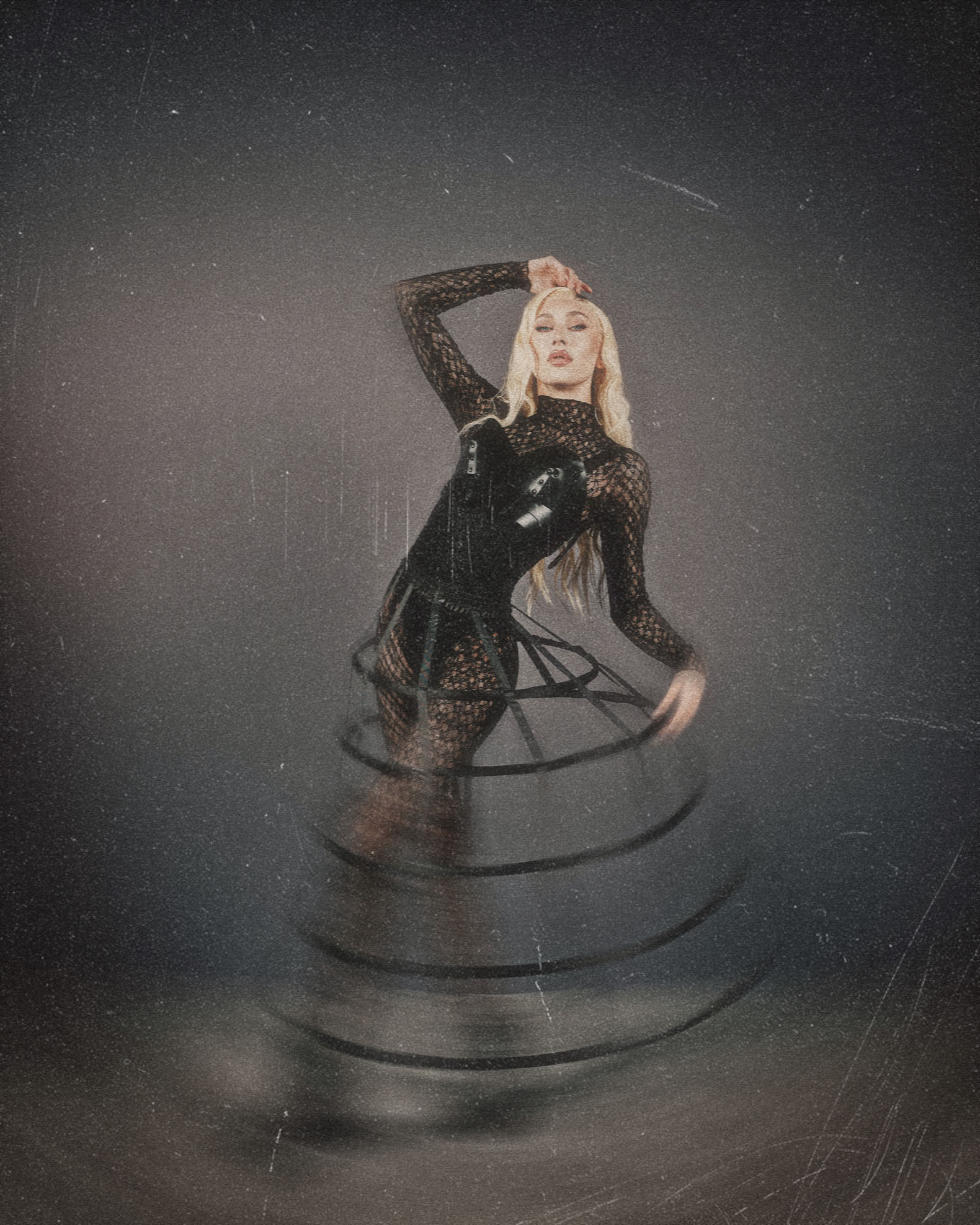 Woman in black lace outfit standing in water with ripples, night sky with stars and a shooting star above.