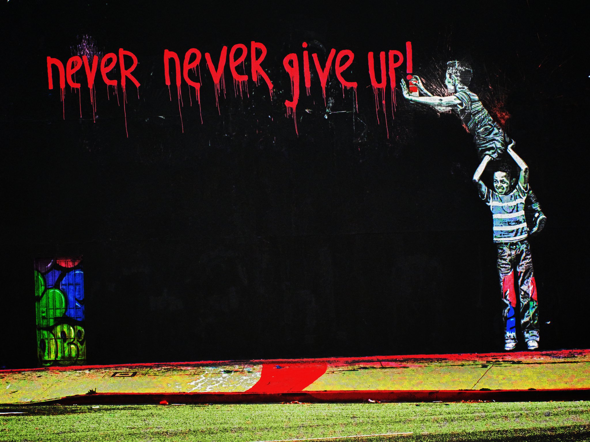 Graffiti art with two children, one reaching out to the other, and the phrase 'never never give up!' in red.
