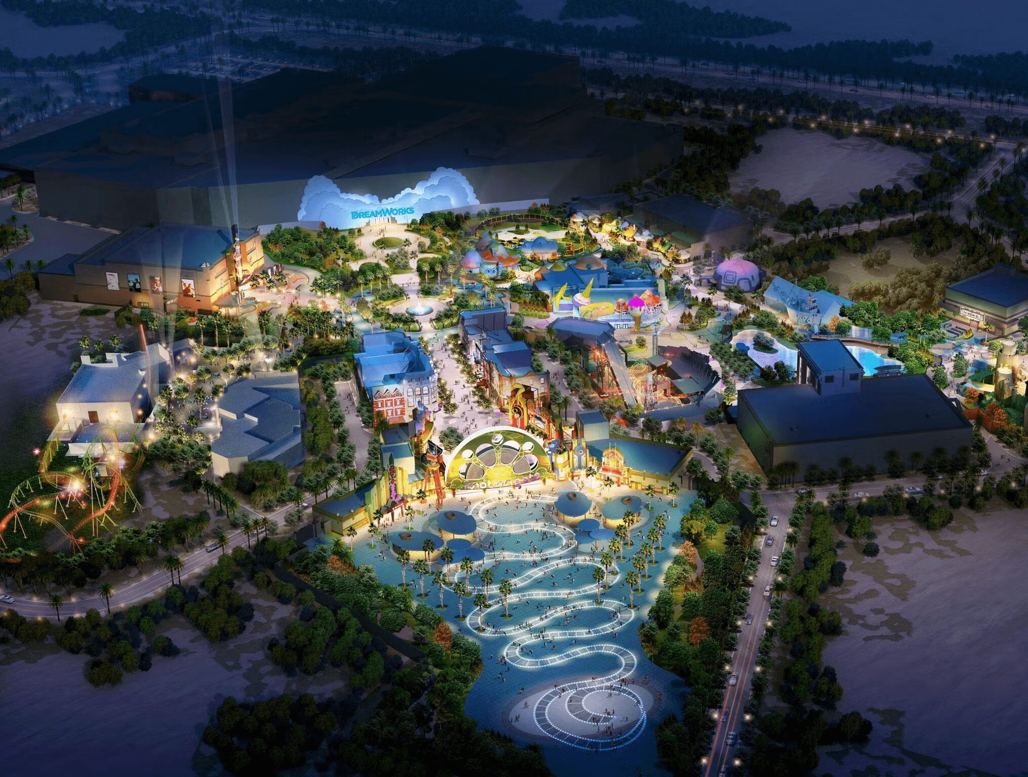 Night view of a water park with slides, pools, and illuminated pathways surrounded by trees and structures.