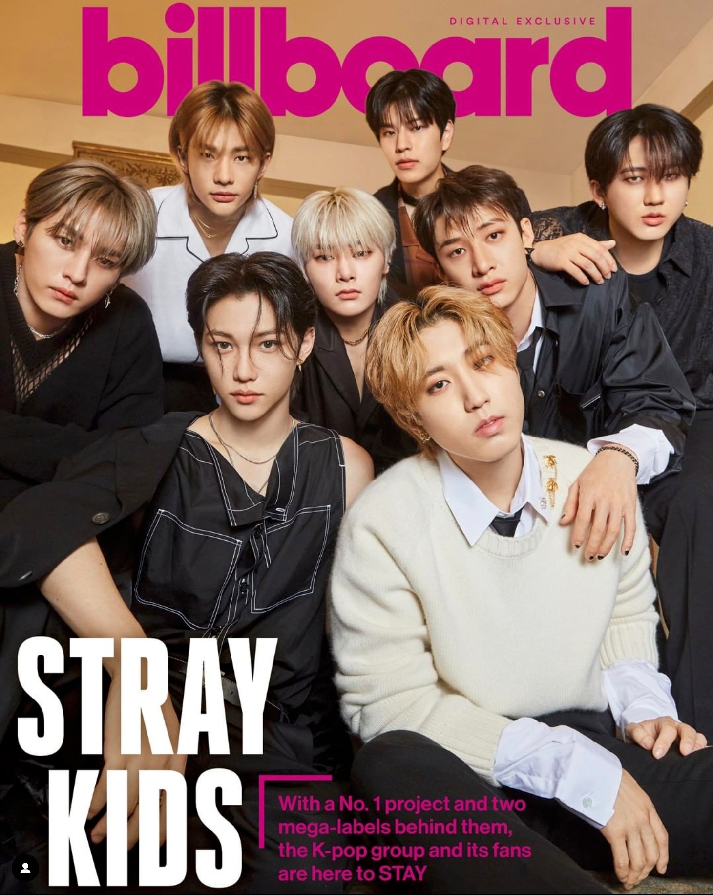 Group of nine young people posing together for a magazine cover, with a pink and yellow background and the word 'billboard' at the top.