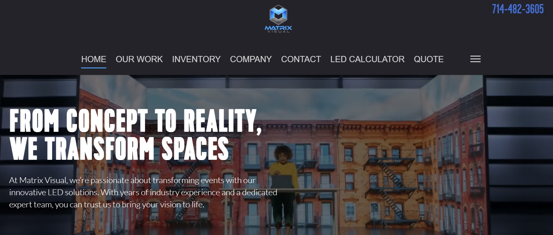 Website homepage with a building image and navigation menu at the top, text overlay about transforming spaces.
