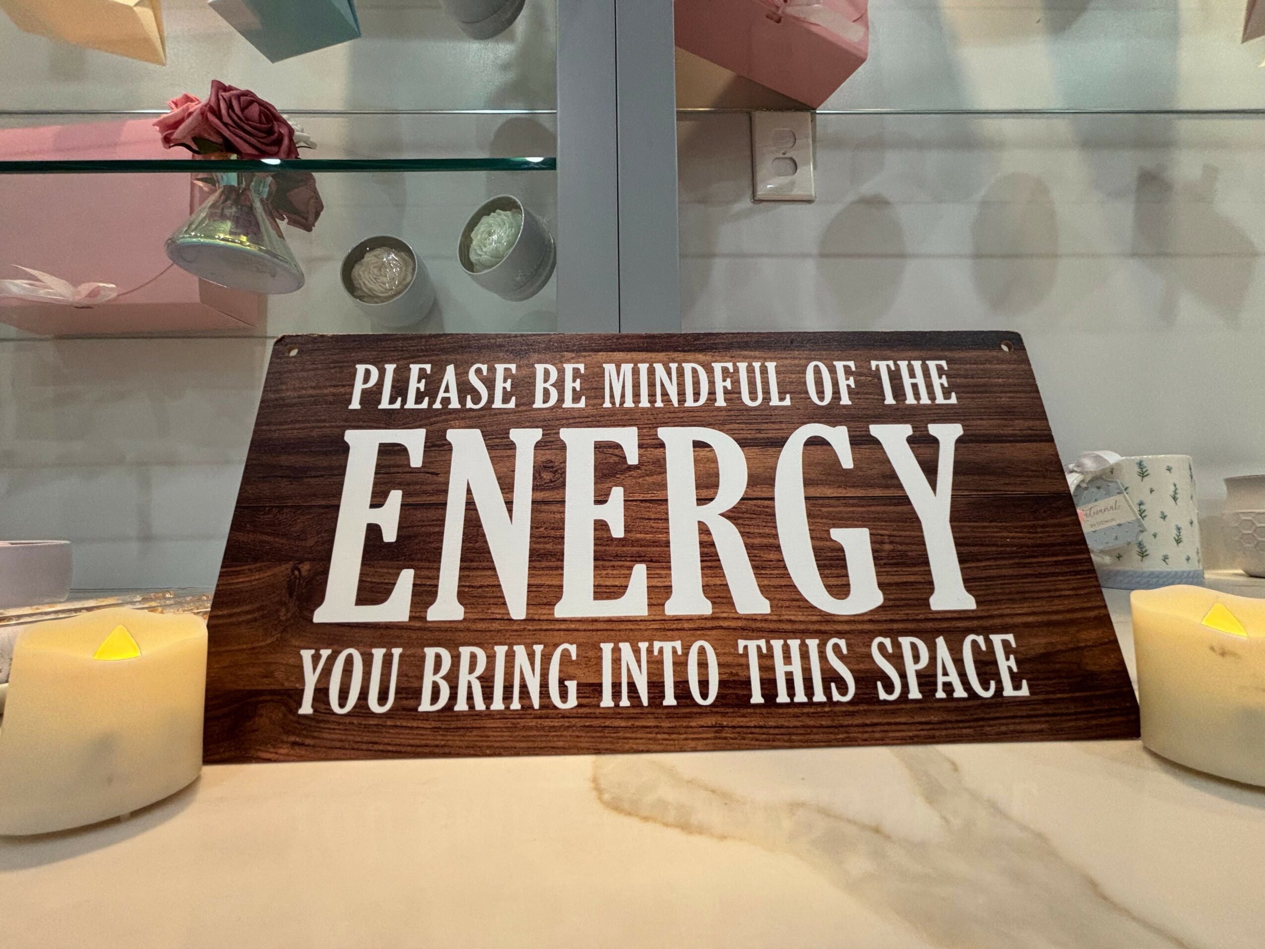 Wooden sign with white text reading, 