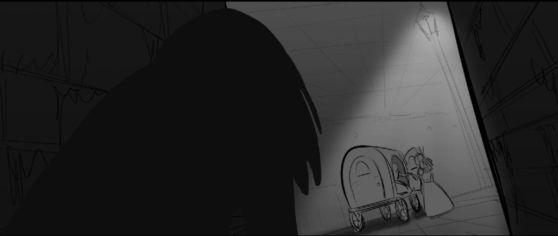 A person with dark hair looks at a small figure near a cart in a dimly lit corridor.