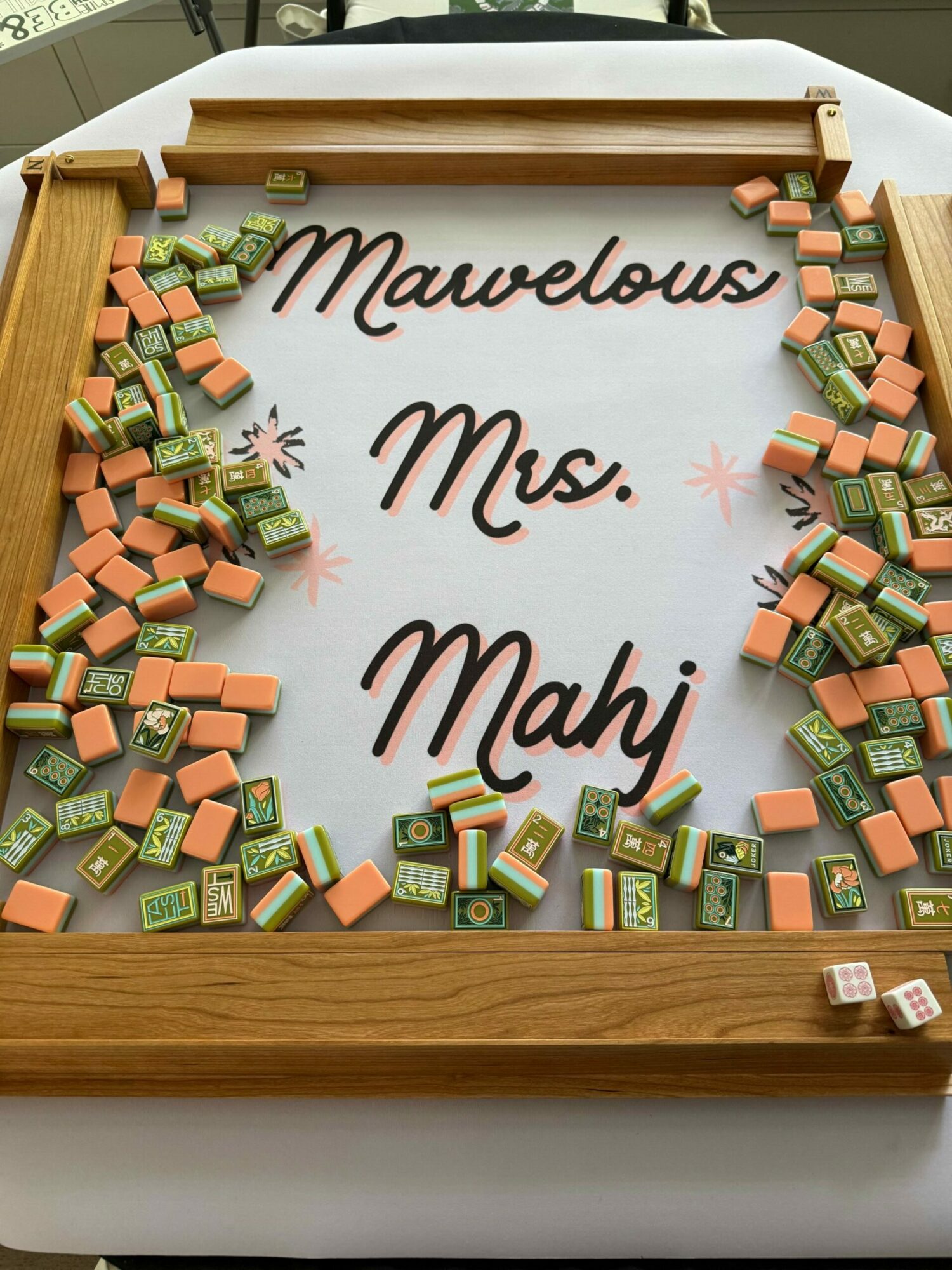 Board with colorful small blocks and handwritten text 'Mauvelous! Mrs. Mayb' in the center.