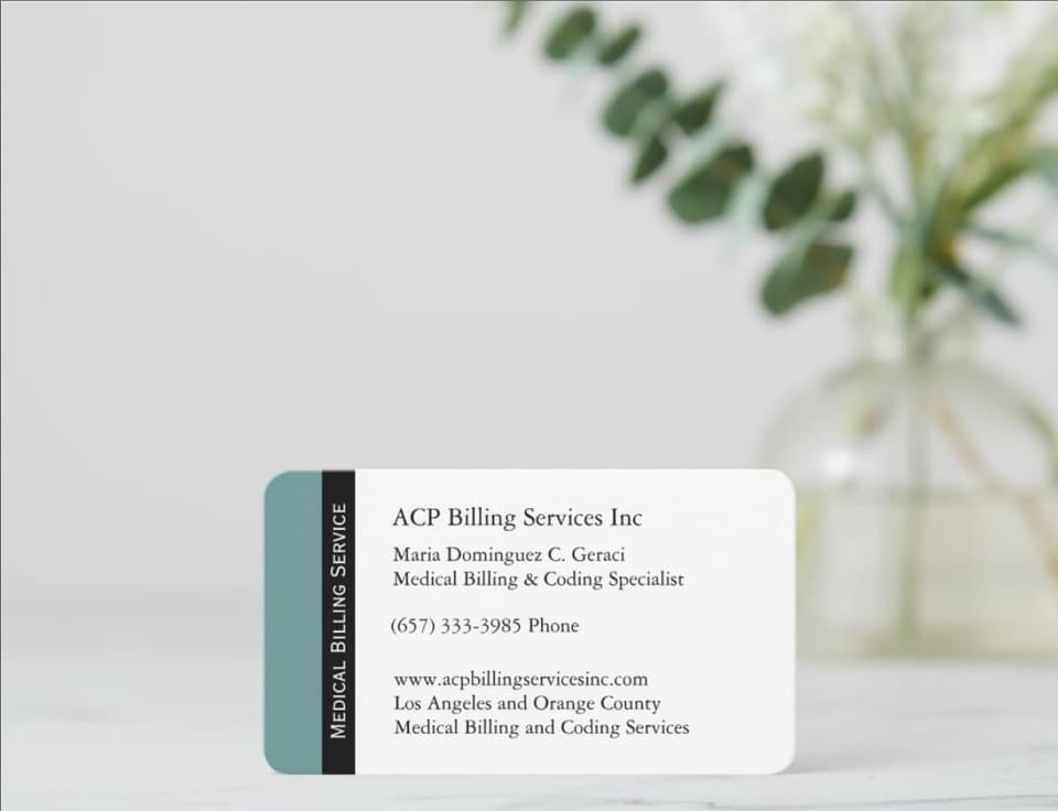 Business card with contact information for medical billing services, placed on a white surface with a blurred plant in background.