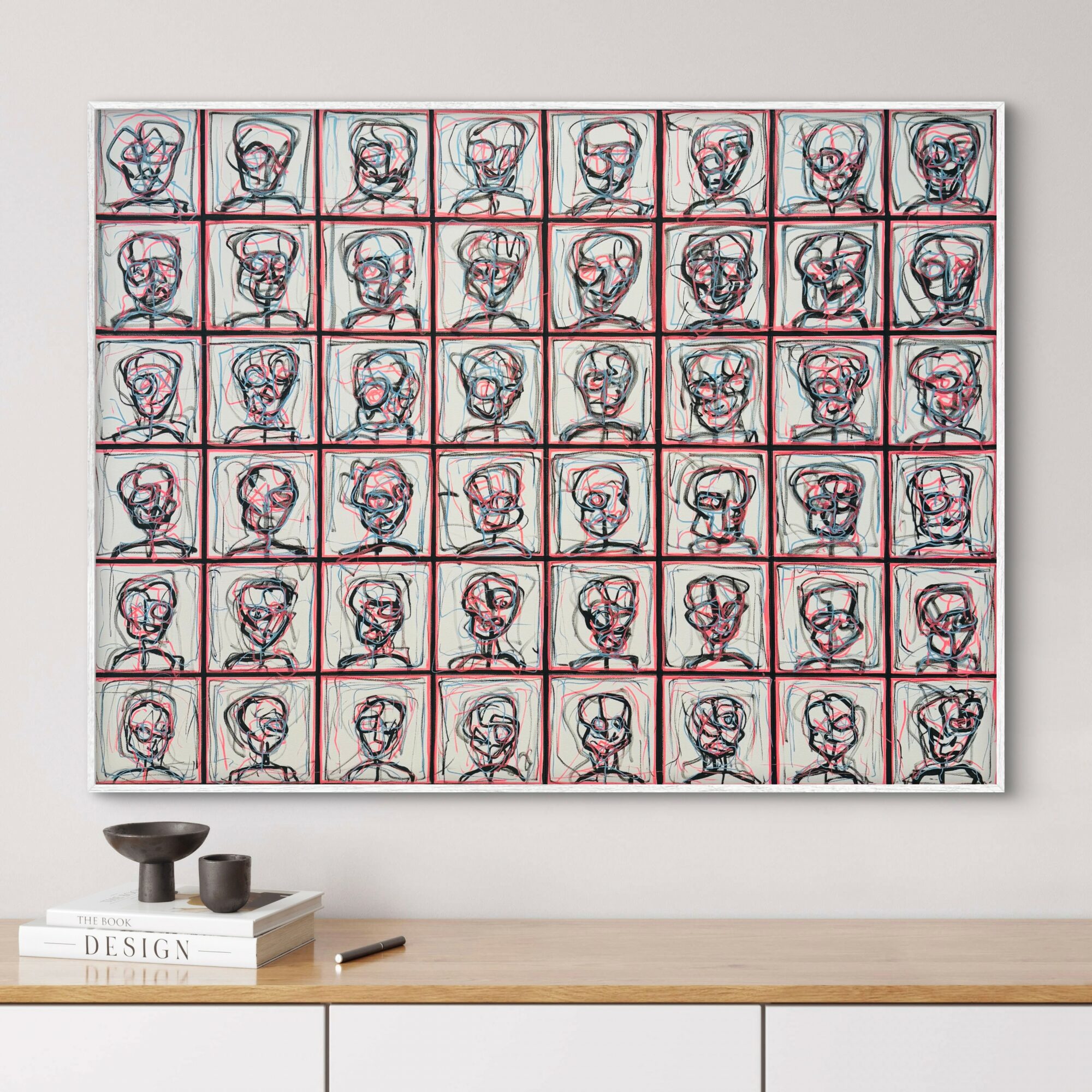 Grid of 49 abstract line drawings of faces, each in a red or blue frame, on a white wall.