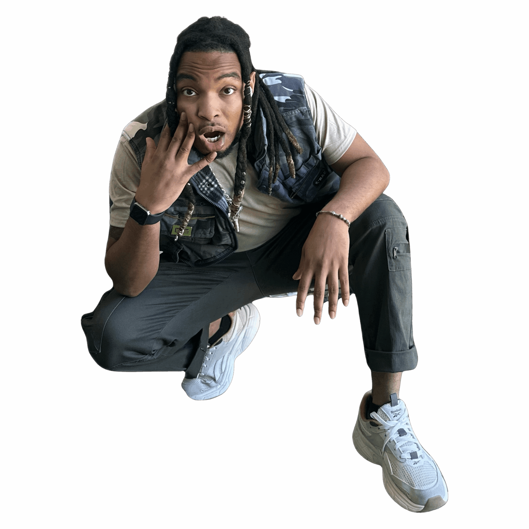 Person crouching with surprised expression, hand on face, wearing casual clothes and sneakers, against a black background.