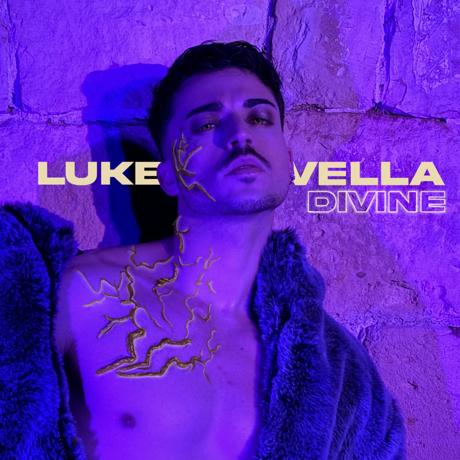 Portrait of a man with dark hair and mustache, illuminated by purple light, against a textured wall background.