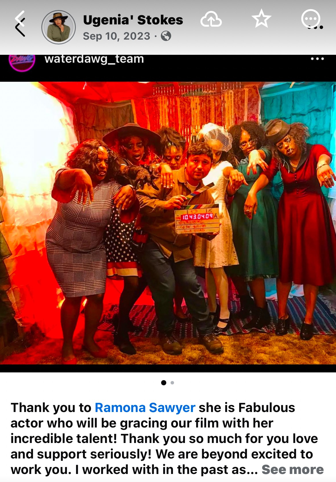 Group of people dressed in colorful costumes, standing together in front of a vibrant backdrop, celebrating with smiles and props.