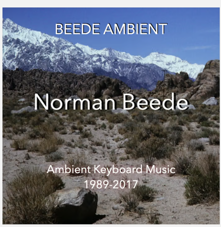 Mountain landscape with snow-capped peaks and desert terrain, text overlay about ambient keyboard music by Norman Beede, 1989-2017.