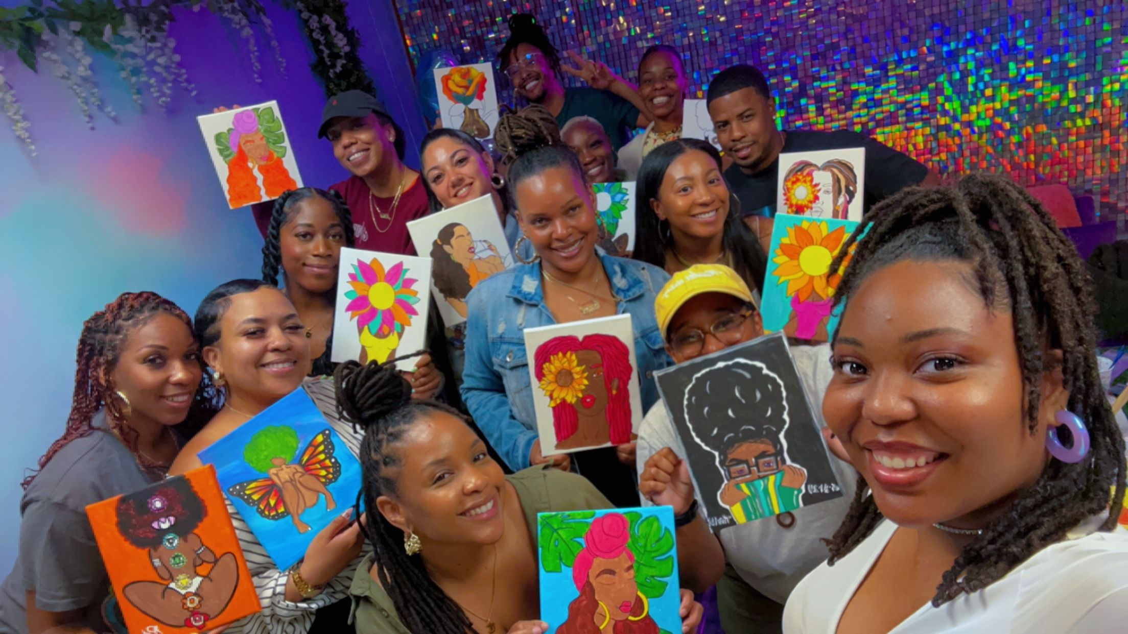 Group of children holding colorful drawings, smiling, with a vibrant, decorated background.