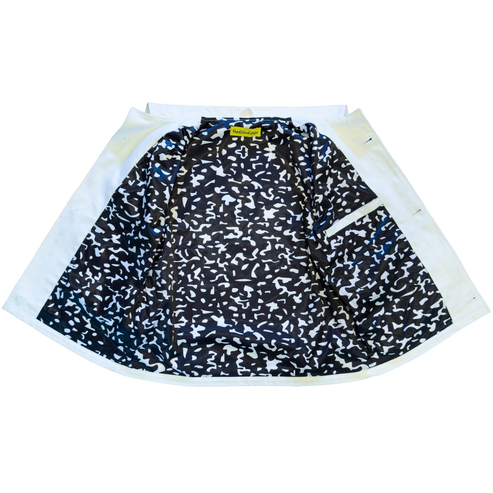 A black and white patterned skirt with a yellow tag, laid flat on a white background.