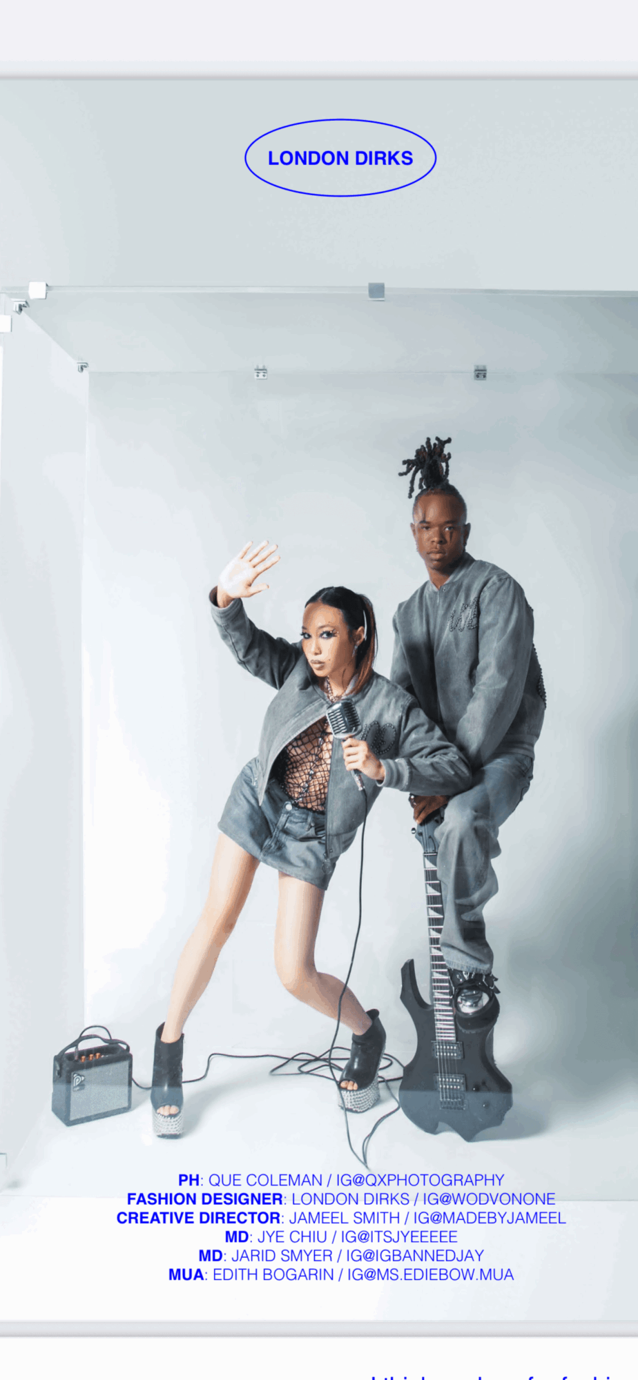 Two people in casual clothing pose in a studio with a white background and a sign reading 'LONDON DRINKS' above them.